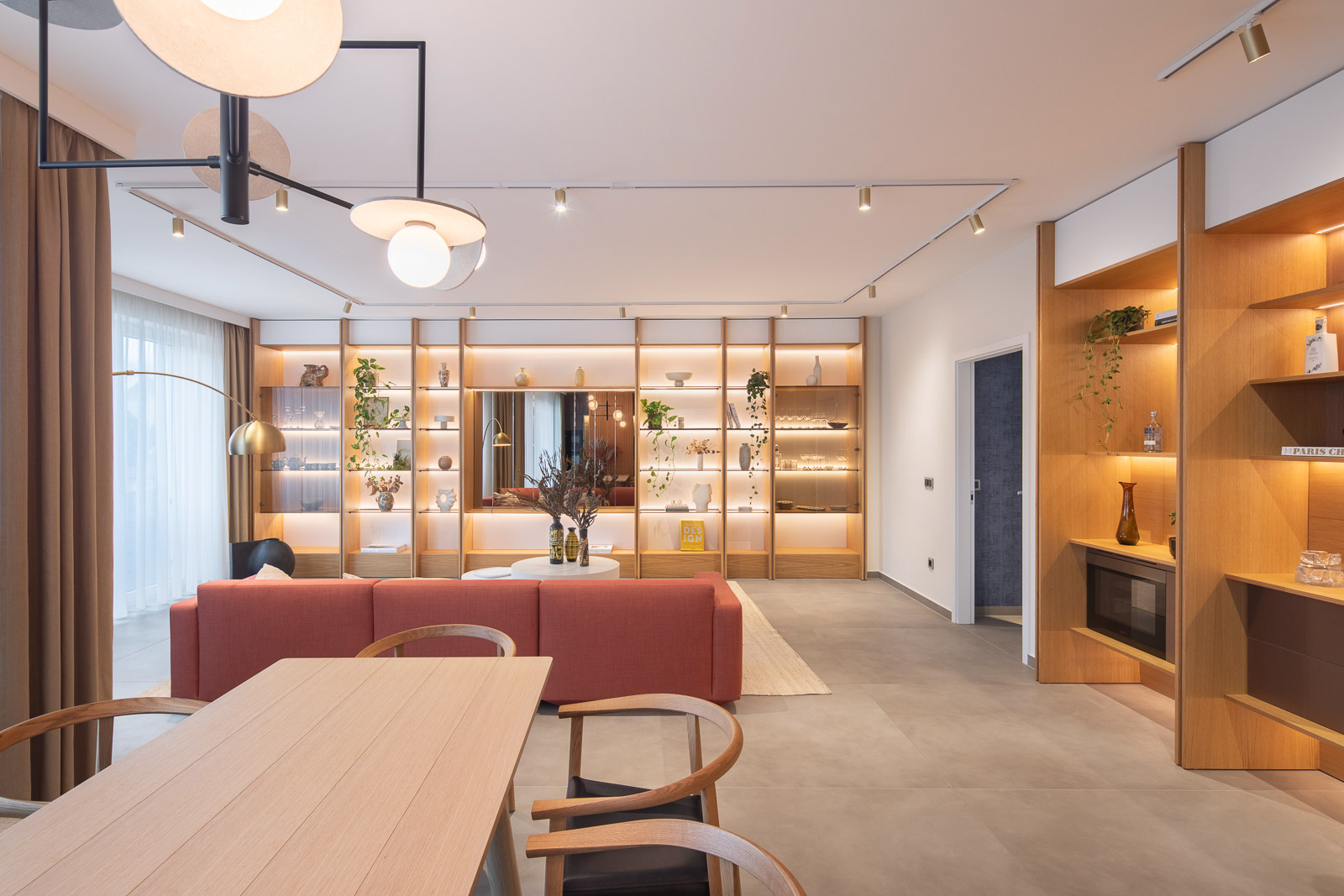 Beethoven Penthouse, Budapest — warm timber living space opening to the city